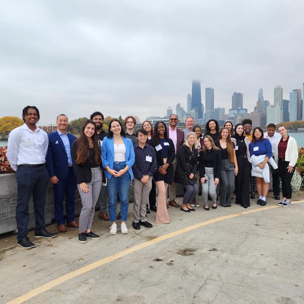 Students pose with the Chicago skyline in the background.